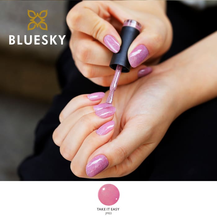 Bluesky Nude Baby Pink Take It Easy Gel Polish with fine glitter with model shown applying gel polish to her nails