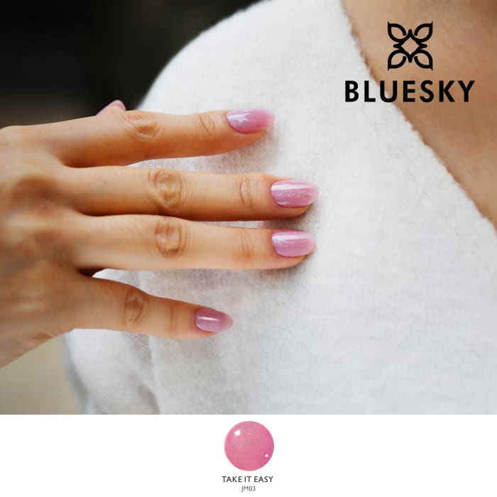 Bluesky Nude Baby Pink Take It Easy Gel Polish with fine glitter on models nails against a cream jumper