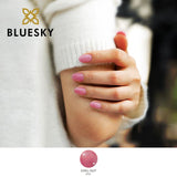 Bluesky Nude Pink Chill Out Gel Polish with fine glitter on models hands who is wearing a cream jumper