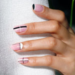 Image showing Bluesky No Wipe Golden Sand effect Top Coat  on top of light pink gel polish with black nail art detail. 
